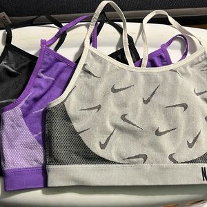 Three youth XL anime sports bras.